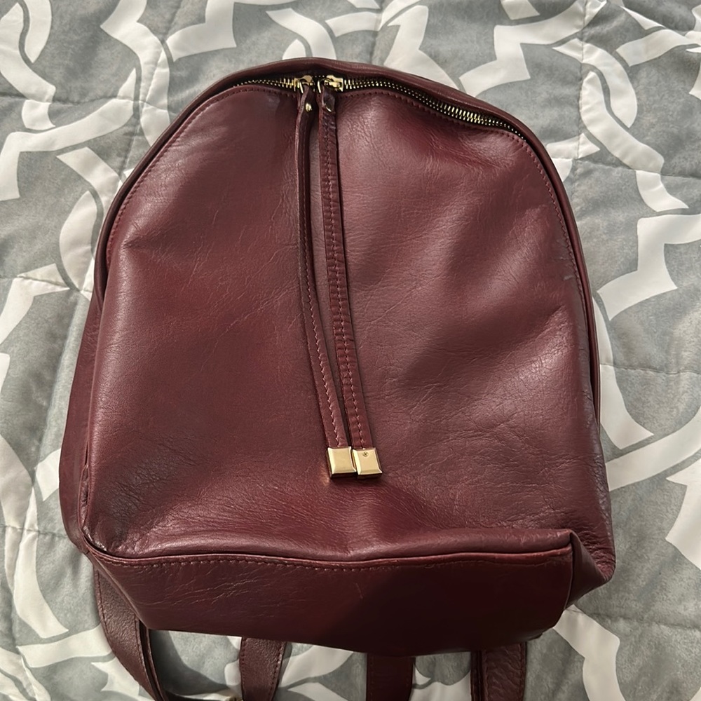 Never been used. leather maroon bookbag